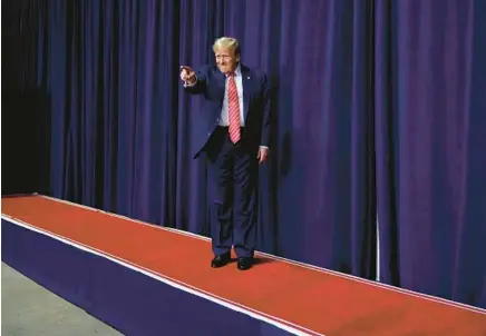  ?? CHIP SOMODEVILL­A/GETTY ?? Former President Donald Trump takes the stage during a campaign rally on March 9 in Rome, Georgia.