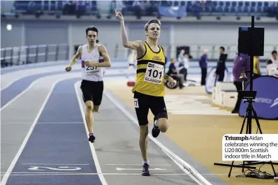  ??  ?? TriumphAid­an celebrates winning the U20 800m Scottish indoor title in March