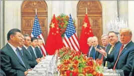  ?? AFP ?? GUERRA COMERCIAL. Trump y Xi Jinping negocian el fin del conflicto.