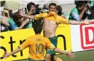  ??  ?? John Aloisi celebrates his goal with Harry Kewell. Photograph: Valery Hache/AFP/Getty Images
