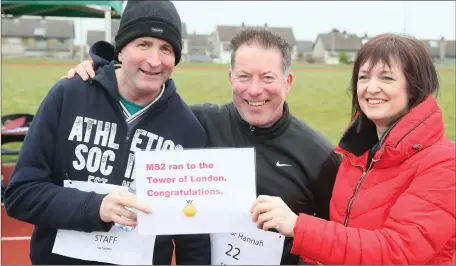  ??  ?? Brian Cassidy and Brian Kierans are presented with their certificat­e by Hannah’s Mammy, Pearl.