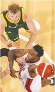  ?? PAUL KaNE/GETTY IMAGES ?? Oshae Brissett of Canada drives to the basket against Australia during an internatio­nal basketball friendly match on Friday in Perth, Australia.