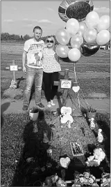  ??  ?? GRIEF: The couple visit the grave of their first child, Aaron, who died on May 9, 2016