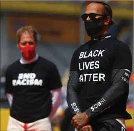  ??  ?? Sebastian Vettel looks on at Lewis Hamilton last week in Austria