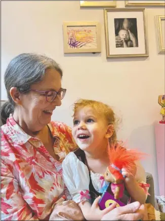  ?? (Courtesy Photo/Elisa Pupko) ?? Mary Pupko laughs with her granddaugh­ter Evelyn. Pupko, a 64-year-old retired seamstress with multiple sclerosis, moved to Brooklyn from Seattle to be closer to her family.