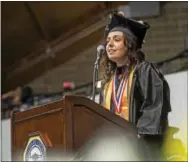  ?? RICK KAUFFMAN — DIGITAL FIRST MEDIA ?? Gina DiLuzio speaks at the student address to the 2017 graduates of Delaware County Community College.