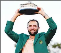  ?? ?? Scottie Scheffler holds the trophy after winning the Masters golf tournament at Augusta National Golf Club Sunday, April 14, 2024, in Augusta, Ga. (AP)