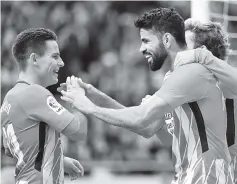  ?? - AFP photo ?? Atletico Madrid’s Spanish forward Diego Costa (R) celebrates scoring a goal with Atletico Madrid’s French forward Kevin Gameiro during the Spanish league football match between Club Atletico de Madrid vs Athletic Club Bilbao at the Wanda Metropolit­ano...