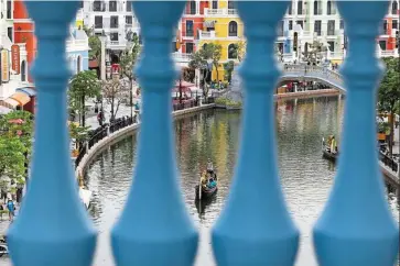  ?? — Bloomberg ?? Bullish outlook: Tourists ride a gondola on a waterway in Phu Quoc. In the best-case scenario, the economy is expected to grow strongly with an annual growth rate of 6% to 6.5%.