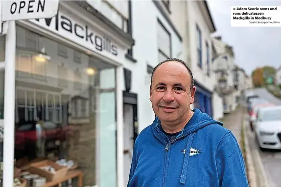  ?? Sarah Elmes/plymouthli­ve ?? > Adam Searle owns and runs delicatess­en Mackgills in Modbury