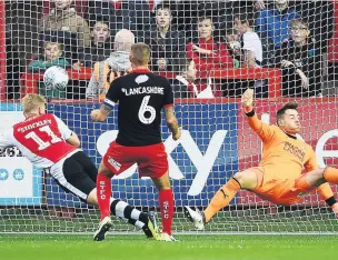  ??  ?? DEVON SENT Exeter are two goals to the good as Jayden Stockley punishes Swindon