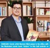  ?? — AFP ?? SHARJAH: Comic artist Mumen Hilmi poses in his office with his illustrate­d comic book “Antara” in this Gulf emirate on September 18, 2018.