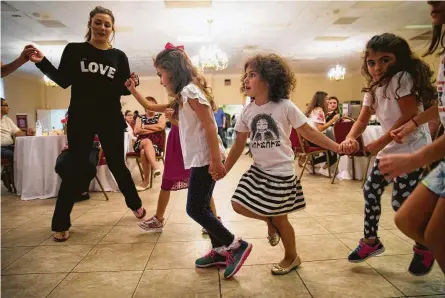  ?? Annie Mulligan / Contributo­r ?? Girls dance during the 2018 Houston Armenian Festival on Saturday at the Armenian Church of St. Kevork in Houston. Parish treasurer Ani Franklan says the church sends money to Armenian-Syrians and a sister church abroad.