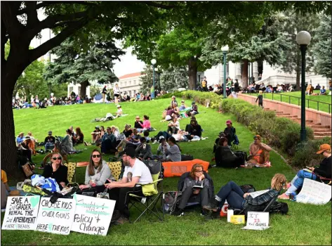  ?? PHOTO BY RJ SANGOSTI — THE DENVER POST ?? Here 4 the Kids, a group of mostly moms, staged a sit-in asking for an executive order to ban guns in Colorado on Monday in Denver. Over a thousand people took part in the rally outside the Colorado State Capitol.