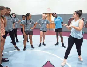  ?? ARIEL COBBERT/THE COMMERCIAL APPEAL ?? Colliervil­le girls wrestling team coach Mary Catherine Correia hopes the program will inspire more area schools to field teams.