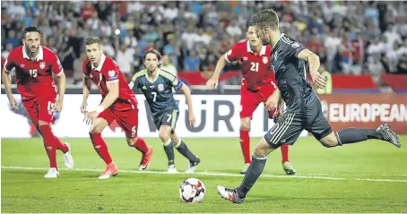  ?? Picture: Getty. ?? Aaron Ramsey scores from the penalty spot in Wales’ 1-1 draw against Serbia.