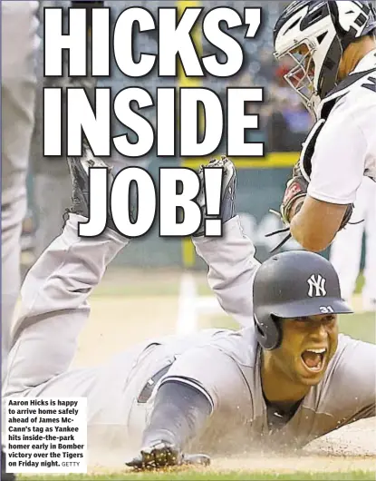  ?? GETTY ?? Aaron Hicks is happy to arrive home safely ahead of James McCann’s tag as Yankee hits inside-the-park homer early in Bomber victory over the Tigers on Friday night.