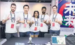  ?? PHOTOS PROVIDED TO CHINA DAILY ?? Above: A team led by Peter Ma (second from left) from the United States that produced the Clear Water AI finishes as the runner-up in this year’s China-US Young Maker Competitio­n. Top: About 400 finalists from 75 teams from the two countries compete in the 24-hour hackathon in Beijing.