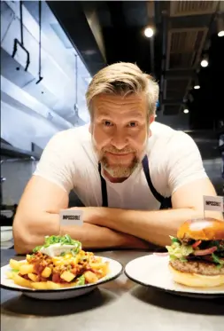  ??  ?? Left: Uwe Opocensky, former chef at Beef & Liberty, with a burger and loaded french fries, both made with Impossible meat. Right-: the company’s plantbased meat is also used in various dim sum dishes at the Empress restaurant in Singapore