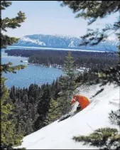  ?? Ryan Salm Photograph­y ?? Pro skier Errol Kerr slashes through powder high above Lake Tahoe at Homewood Mountain Resort.