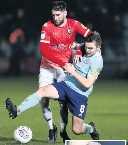  ??  ?? Sam Finley challenges Joey Jones of Salford City during the Leasing.com Trophy Quarter Final at Moor Lane. Right: John Coleman