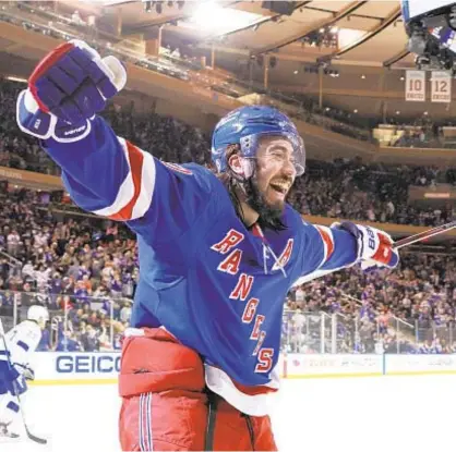  ?? GETTY ?? Mika Zibanejad celebrates his hat trick in Rangers’ victory over Lightning Sunday afternoon at Garden.