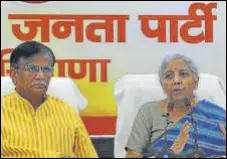  ?? KESHAV SINGH/HT ?? Union finance minister Nirmala Sitharam addressing a press conference in Chandigarh on Friday as Haryana BJP chief OP Dhankar looks on.