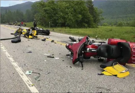  ?? MIRANDA THOMPSON — FOR THE ASSOCIATED PRESS ?? Damaged motorcycle­s are scatted on two-lane U.S. 2 Friday evening in Randolph, N.H., after a pickup truck collided with the riders. The motorcycli­sts belonged to a club called the Marine JarHeads MC. NEW HAMPSHIRE