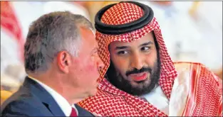  ?? AP PHOTO ?? Jordan’s King Abdullah II, left, listens to Saudi Crown Prince Mohammed bin Salman, at the Future Investment Initiative conference, in Riyadh, Saudi Arabia, Tuesday.