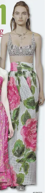  ?? AP PHOTOS ?? GARDEN PARTY: Colorful prints blossom on outfits by, from left, Michael Kors, Zac Posen and Tory Burch.