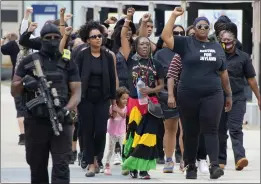  ?? GENE J. PUSKAR — THE ASSOCIATED PRESS ?? A group arrives to pay respects at a memorial service for Jayland Walker on Wednesday in Akron, Ohio. Walker, a Black motorist, was unarmed when killed by Akron police, who said he earlier had fired a gun. An examinatio­n found 60 bullet wounds on his body.