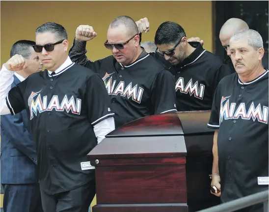  ?? — THE ASSOCIATED PRESS ?? Pallbearer­s wearing team jerseys carry the casket of Miami Marlins pitcher Jose Fernandez after a private funeral service Thursday in Miami. Fernandez was killed in a boating accident Sunday along with two friends.