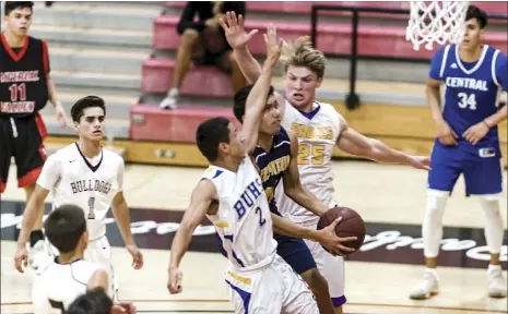  ??  ?? Calipatria High’s Izrael Tampubolon (middle) makes his way in between defenders during the annual Imperial Valley College Senior All-Star game held at IVC last month. Tampubolon earned All-Desert League first team honors this season. VINCENT OSUNA FILE PHOTO