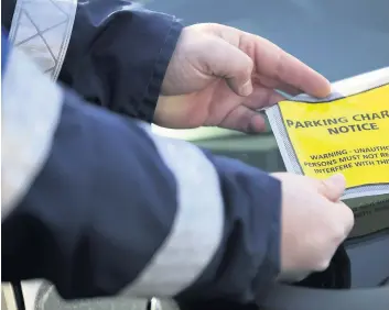  ??  ?? Parking mad More than 22,000 parking notices were issued last year across South Lanarkshir­e