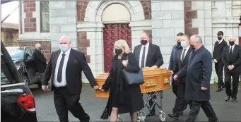  ??  ?? The Heaney family accompanyi­ng their father’s coffin at St. Mary’s Church on Monday.