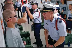  ?? (AP/The Day/Sean D. Elliot) ?? Whisky 2 company Cadre Jacob Denns (right) shouts instructio­ns to swab Nicolas Fisher of Pelham, N.H., on July 1, 2019, the first day of a seven-week indoctrina­tion to military academy life for the Class of 2023 at the U.S. Coast Guard Academy in New London, Conn.