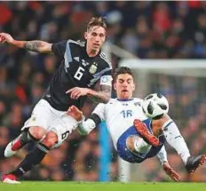  ?? Reuters ?? ■ Argentina’s Lucas Biglia battles for the ball with Italy’s Lorenzo Pellegrini in an internatio­nal friendly match at the Etihad Stadium in Manchester on Friday.