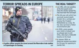  ??  ?? A police officer guards the street around the Noerrebro train station in Copenhagen on Sunday. AFP