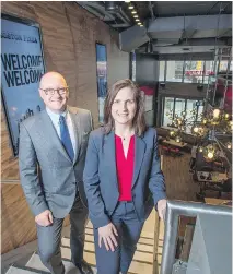  ?? PETER J. THOMPSON ?? Boston Pizza executives Alan Howie and Helen Langford at the company’s new flagship outlet in downtown Toronto. It plans another 25 urban locations in the next few years across Canada.