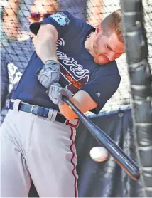  ?? THE ASSOCIATED PRESS ?? The Atlanta Braves’ Freddie Freeman works on his swing during spring training this week in Lake Buena Vista, Fla.