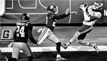  ?? AP Photo/Bill Kostroun ?? Washington Football Team wide receiver Cam Sims (89) catches a pass for a touchdown in front of New York Giants’ Logan Ryan (23) during the second half of an NFL football game on Sunday in East Rutherford, N.J.