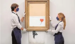  ?? ?? BANKSY ‘Love is in the Bin’ (El amor está en la papelera), vendido hace tres años por
1,4 millones pese a ser triturado, se remató en 25,4 millones, récord del artista