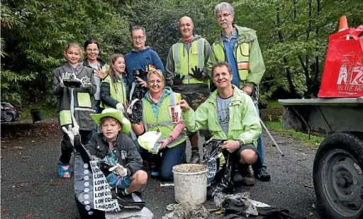  ?? PHOTO: MARION VAN DIJK/ FAIRFAX NZ ?? Hunter McLead, front left, Andrea Warn and organiser Martin Love with Irie Direen, back left, Nicky McLeod, Greer McLeod, Dave McLeod, Ward Carter and Matthias Otto prepare to take part in the Neighbourl­y cleanup at Branford Park.