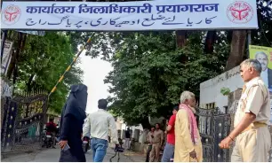  ?? PTI ?? The newly affixed board at the office of the Allahabad District Magistrate, following Uttar Pradesh cabinet’s approval for renaming of the historic city of ‘Allahabad’ as ‘Prayagraj’, on Monday. —