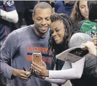  ?? AP PHOTO ?? Los Angeles Clippers forward Paul Pierce, left, poses for a photo with a fan before an NBA game Sunday against the Boston Celtics in Boston.