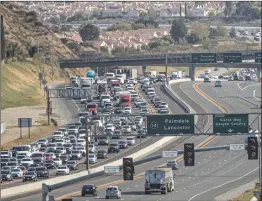  ?? Bobby Block/The Signal ?? Traffic on southbound Highway 14 remained slow Friday morning as investigat­ors continued to collect evidence from a high-speed pursuit that ended with a shooting Thursday night.