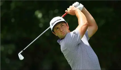  ?? Curtis Compton/Atlanta Journal-Constituti­on via AP ?? Jon Rahm, ranked second behind Dustin Johnson in FedEx Cup points, tees off on the par-3 11th hole during his practice round for the season-ending Tour Championsh­ip at East Lake Golf Club on Wednesday in Atlanta.