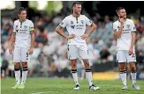 ?? GETTY IMAGES ?? Macarthur FC players reflect on their loss to the Central Coast Mariners last weekend.