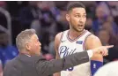  ?? BILL STREICHER/USA TODAY SPORTS ?? 76ers coach Brett Brown has his own style of language when he talks with people such as guard Ben Simmons.