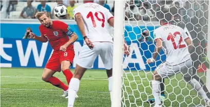  ?? ALASTAIR GRANT/THE ASSOCIATED PRESS ?? Harry Kane’s winning goal for England on Monday was typical of the trend so far in the World Cup, as it came off a corner kick. Many teams have found themselves relying on set pieces and spot kicks for offence during the first five days of the...